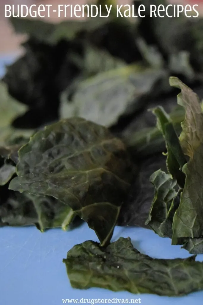 Kale on a cutting board with the words 